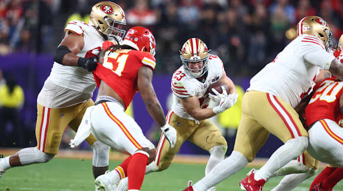 Christian McCaffrey runs with the ball
